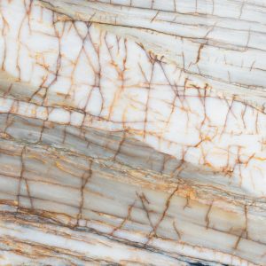 Detailed vertical shot of marble with intricate cracks and natural pattern.